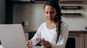 woman holding credit card